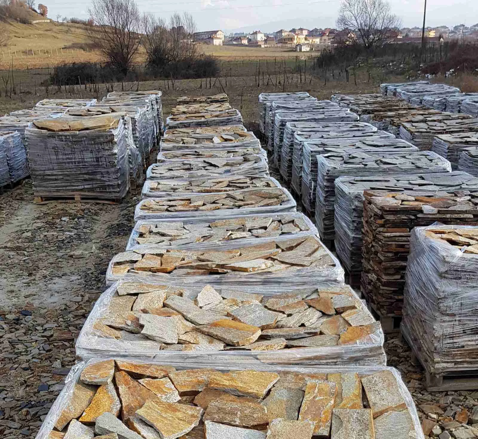 Pallets of gneiss flagstones lined up at the production yard