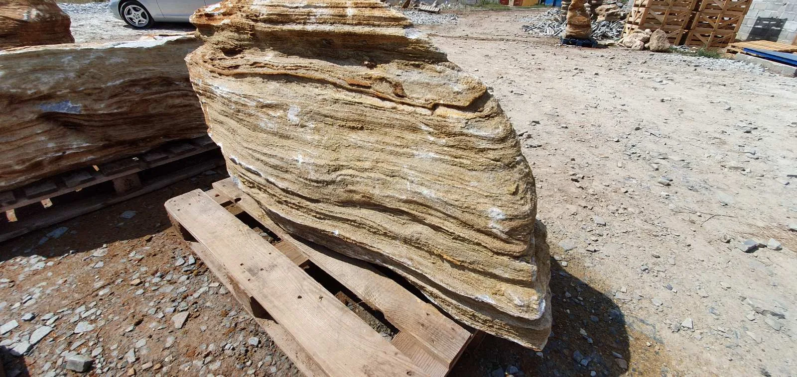 Large layered decorative garden monolith on a wooden pallet