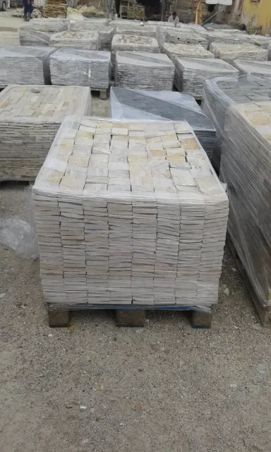 Pallet of cream cut gneiss cladding blocks at the warehouse yard